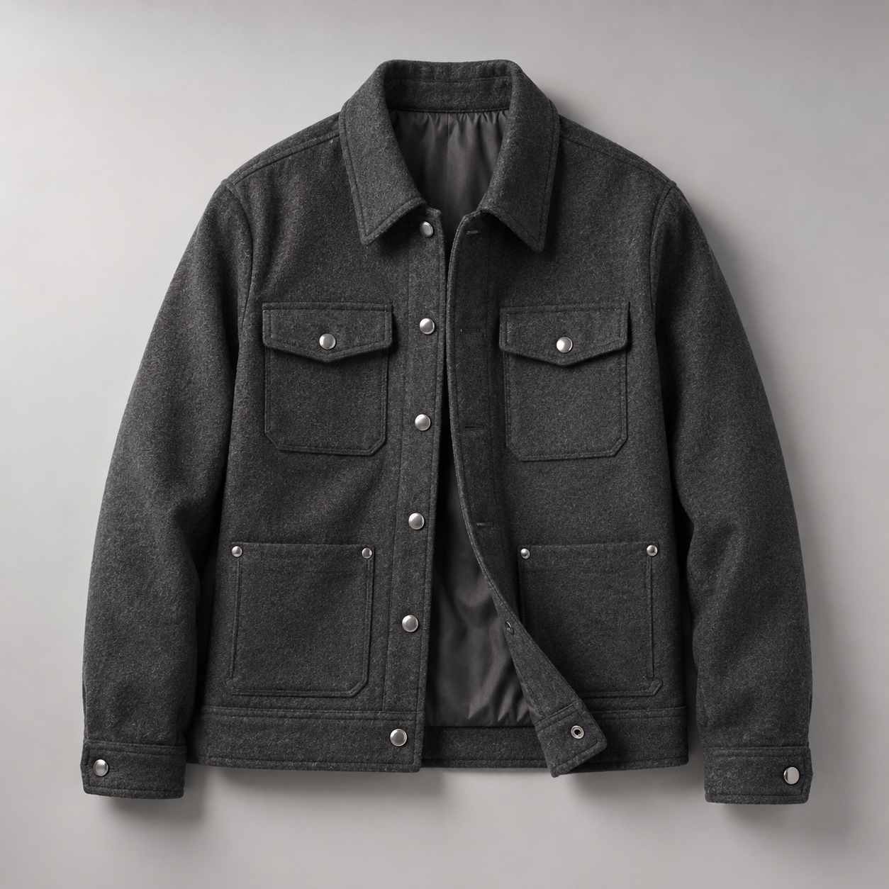 cloth rivets, Cloth rivets are installed on the pockets, front closure and cuffs of a dark gray jacket.